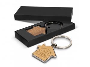 Schlüsselanhänger aus Metall in Hausform mit Geschenkbox